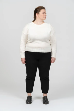 Plump woman in casual clothes standing