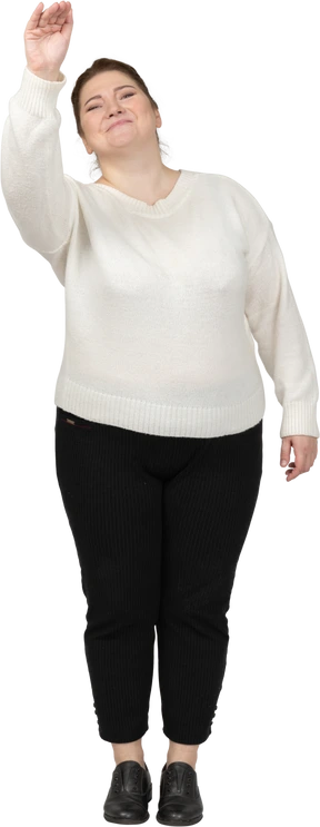 Front view of a plus size woman in casual clothes greeting someone