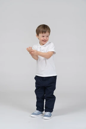 Smiling little boy holding his hand