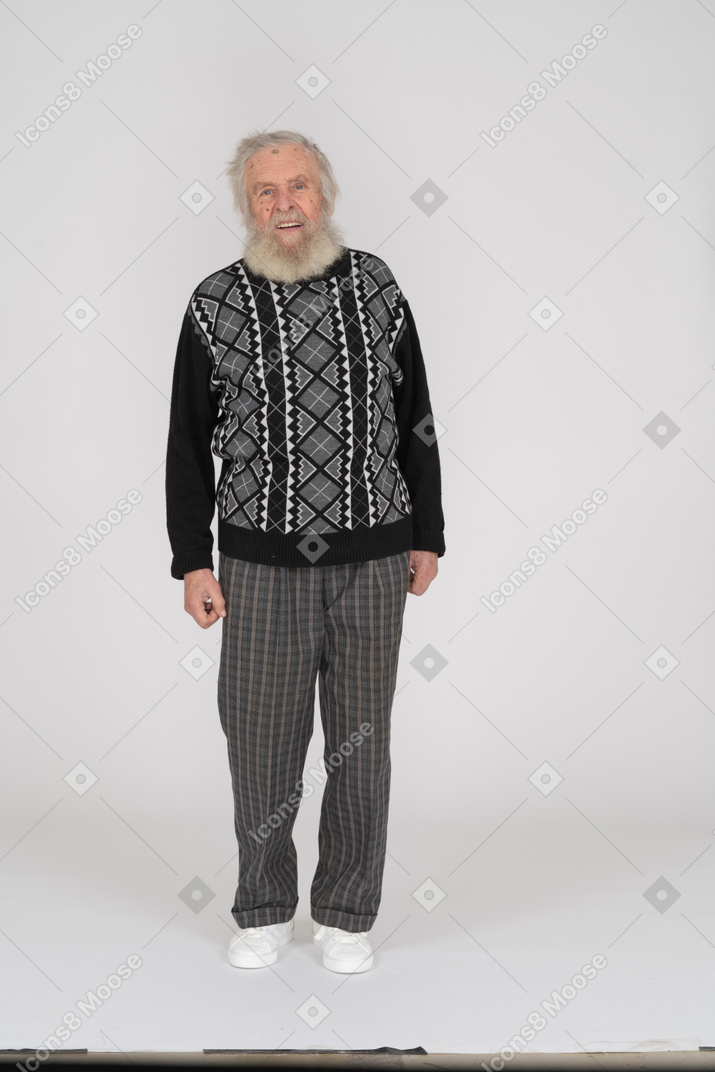 Old man standing and looking at the camera