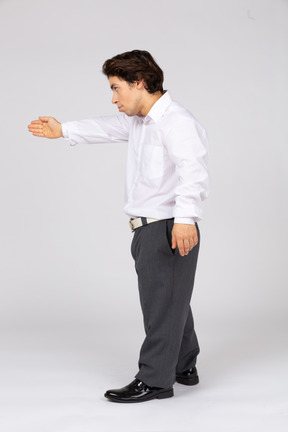 Young man showing direction