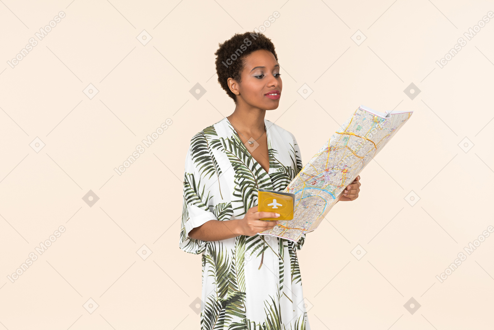 Black short-haired woman in a white and green dress, standing with an international passport and a map in her hands