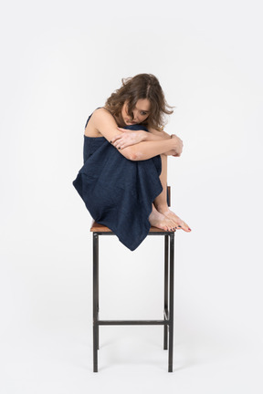 Depressed woman sitting on bar stool