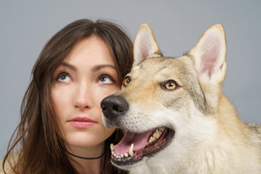 Close-up of a female master with her dog