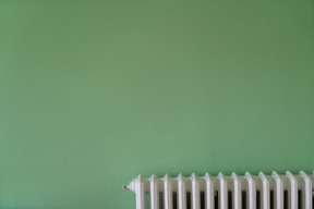 Green wall and white radiator