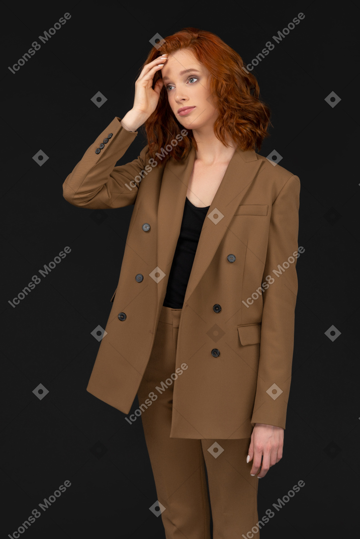 Disappointed-looking woman in brown suit