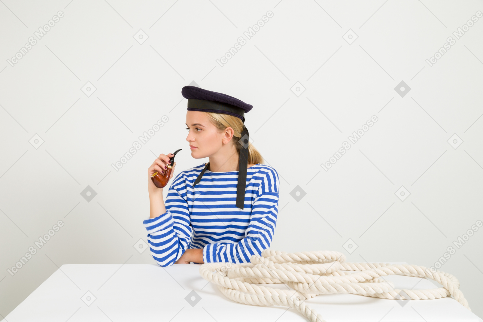 Female sailor holding smoking pipe