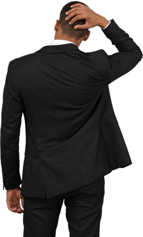 Rear view of a young man in a black suit