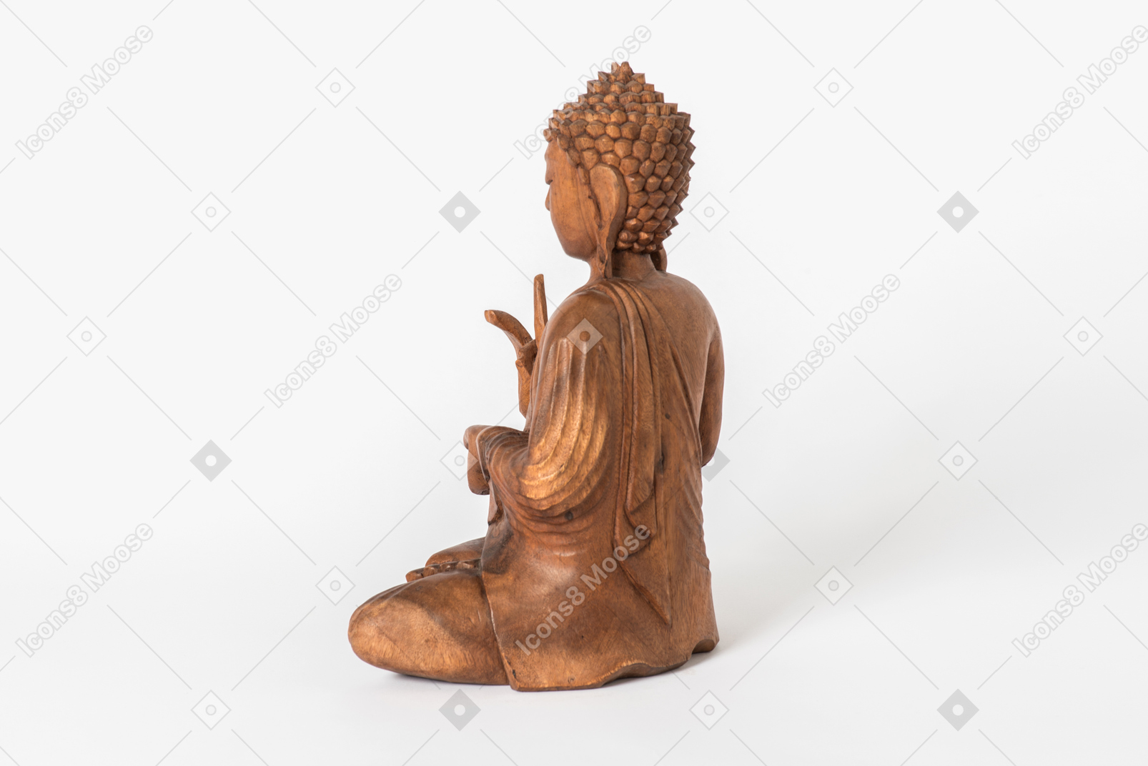 Buddha statue placed half sideways back to camera on white background