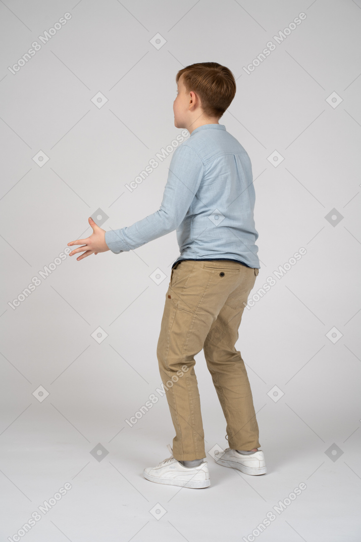 Boy in casual clothes bending his arms