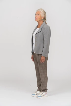 Old lady in suit standing in profile