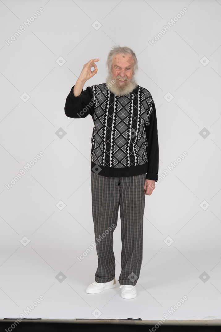 Old man smiling and giving ok gesture