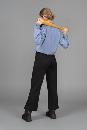 Female security guard holding a baseball bat