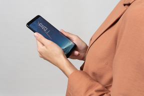 Female hands holding a smartphone