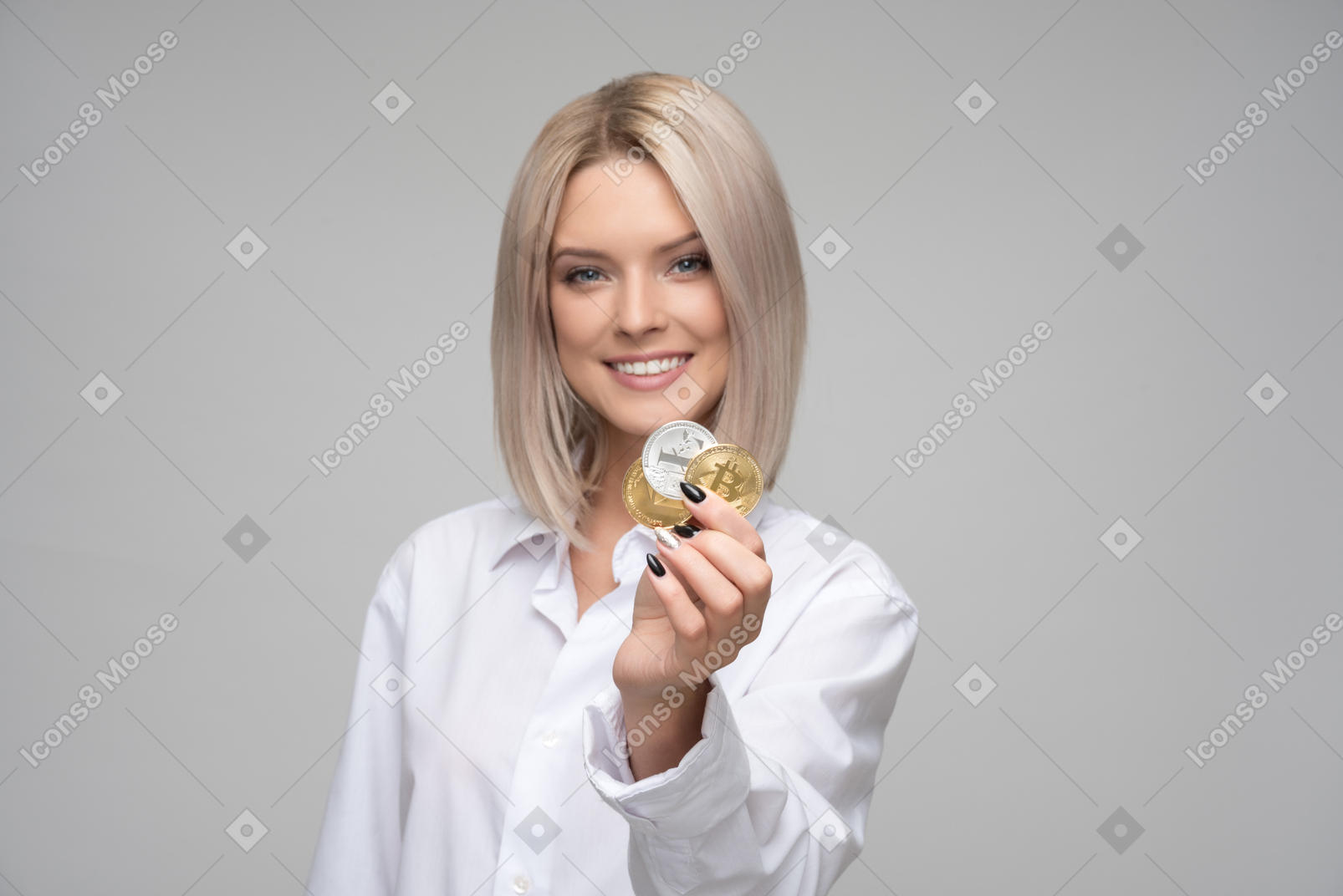 Holding cryptocoins and smiling
