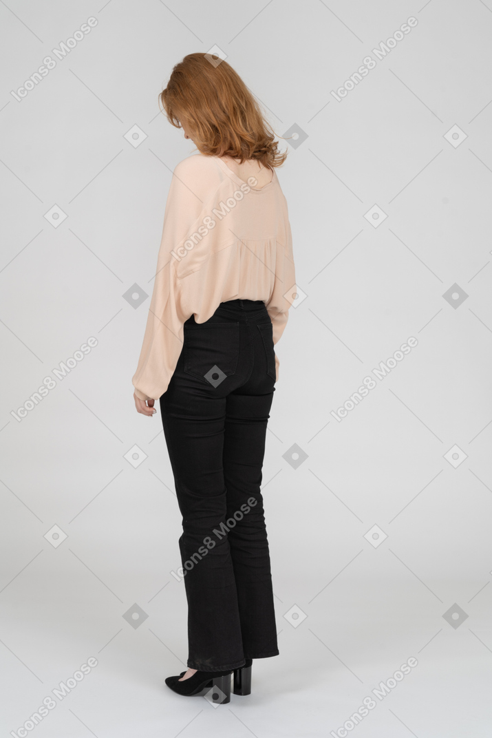 Woman standing with head down