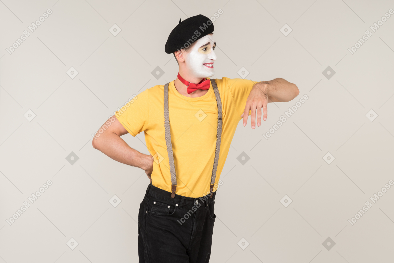Male mime leaning on invisible object