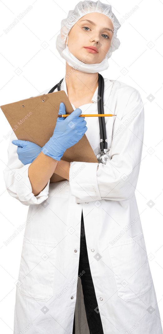Front view of a young female doctor holding pencil and tablet