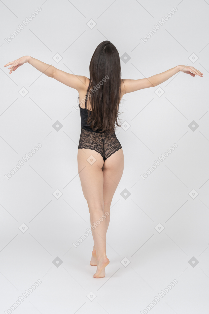 Sensual woman balancing on tiptoes