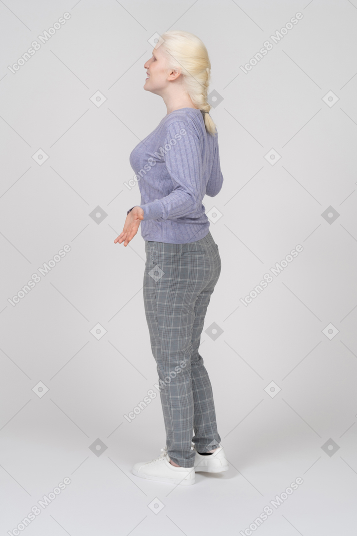 Side view of girl talking and spreading arms