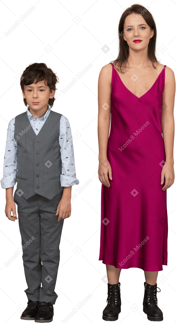 Woman in red dress standing with smiling boy