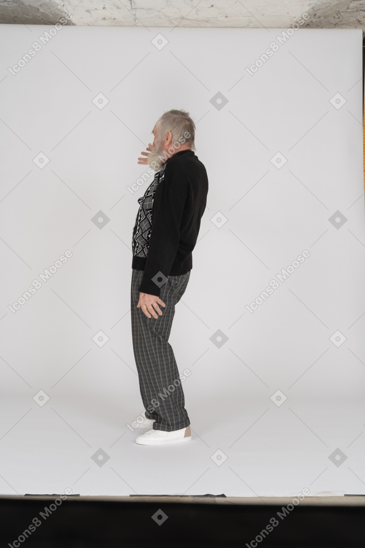 A man looking at a blank poster
