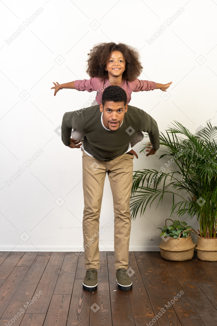 Good looking young man playing with a girl