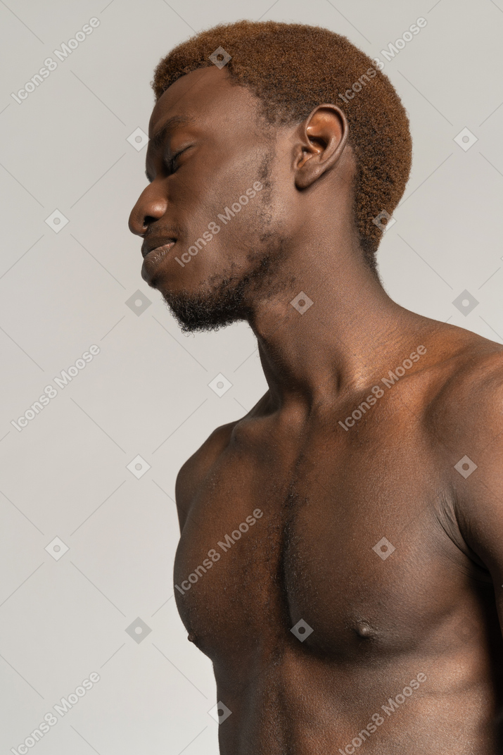 Portrait of topless young man with closed eyes