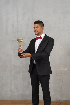 Man in a suit presenting an award