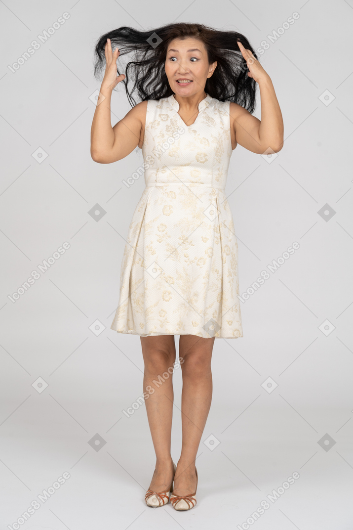 Woman in a white dress standing