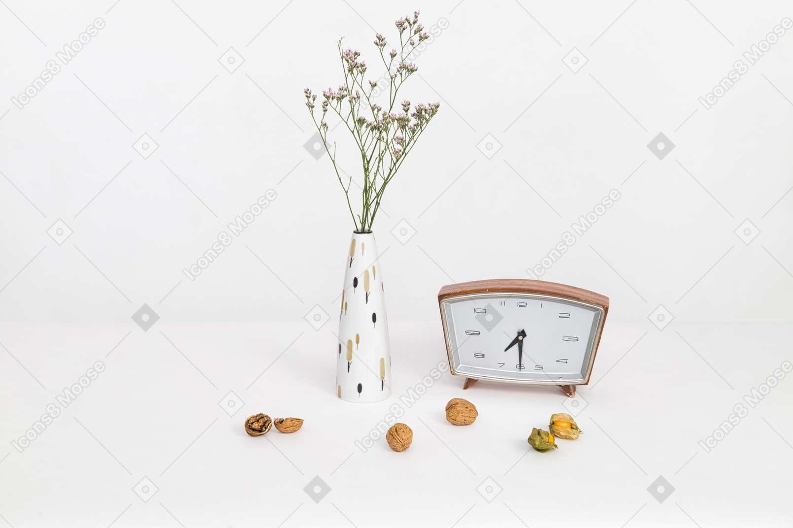 Ceramic vase, vintage clock, walnuts and dried physalis