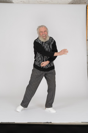 Cheerful old man dancing