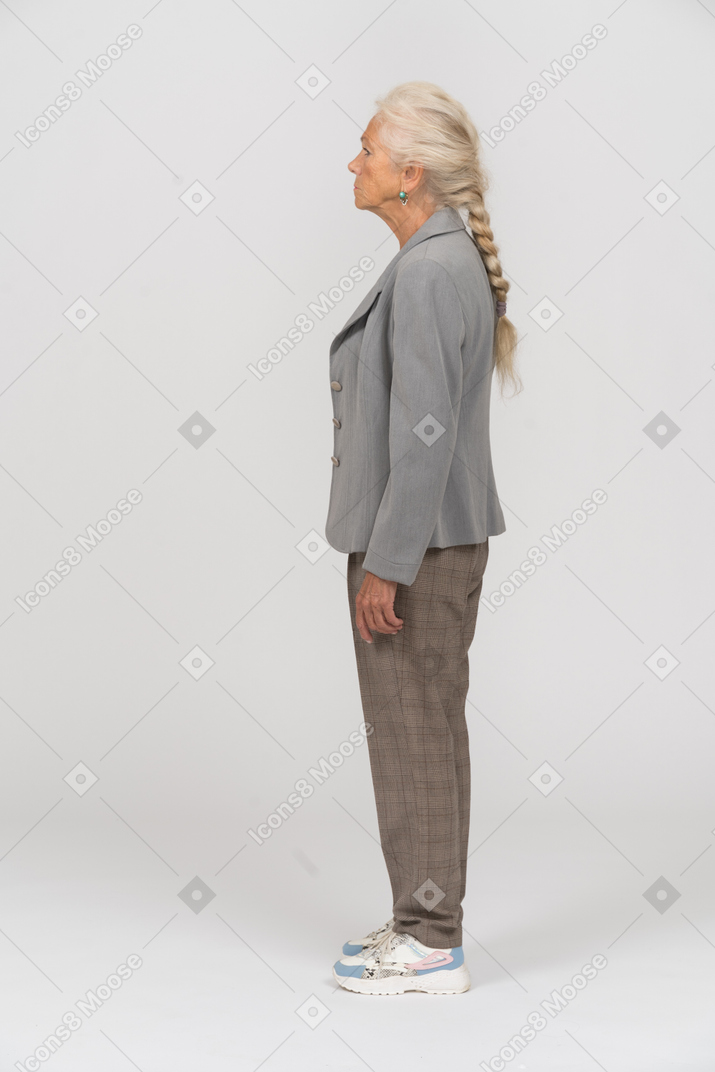 Old lady in suit standing in profile
