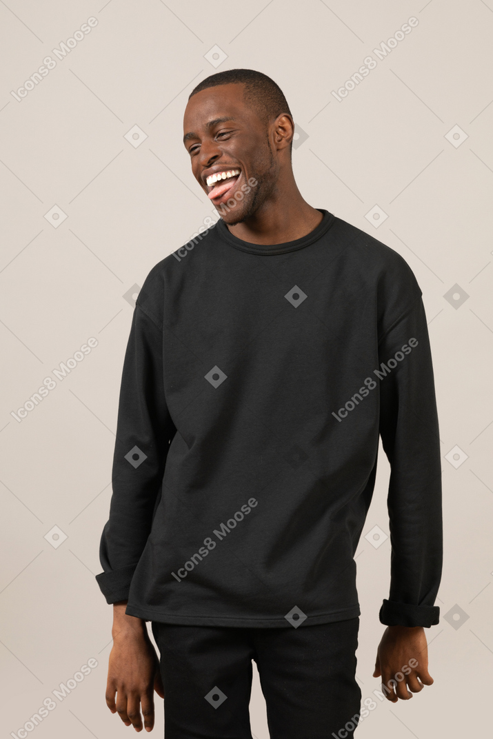 Funny black man showing tongue and laughing