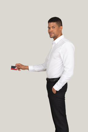 Young man holding a credit card