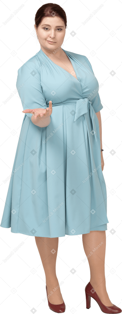Front view of a woman in blue dress gesturing