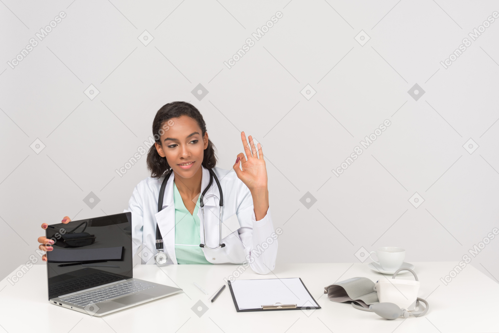 Female doctor showing ok gesture