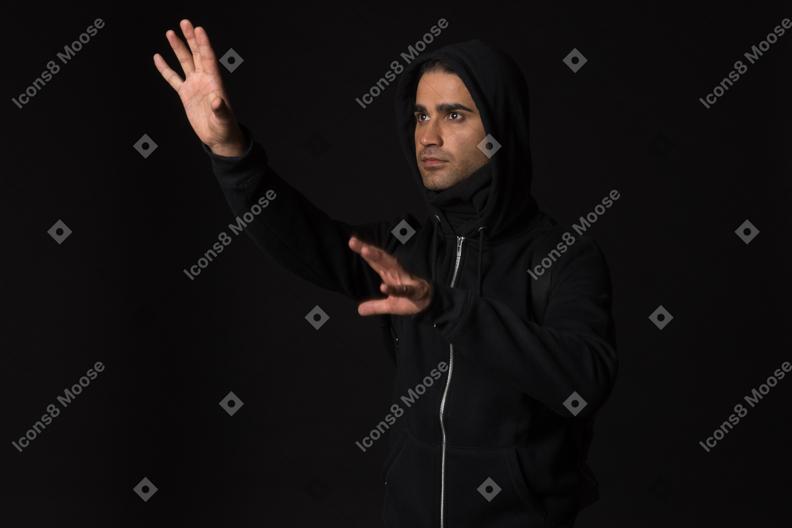 Hacker guy standing in the dark and like touching something with hands
