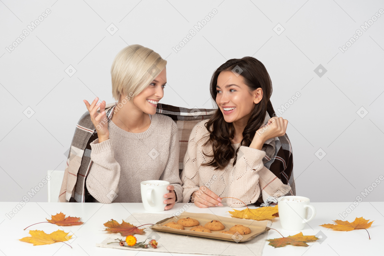 Young women drinking coffee and chatting