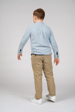 Rear view of a boy in casual clothes