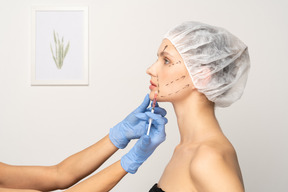 Young woman getting botox injection
