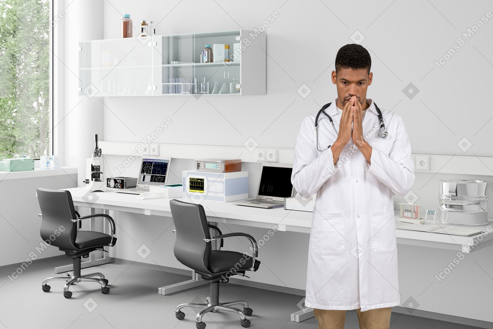 A man in a lab coat standing with folded hands in the lab