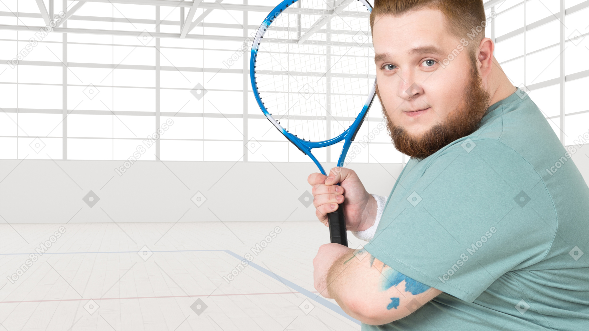 A man with a beard holding a tennis racket
