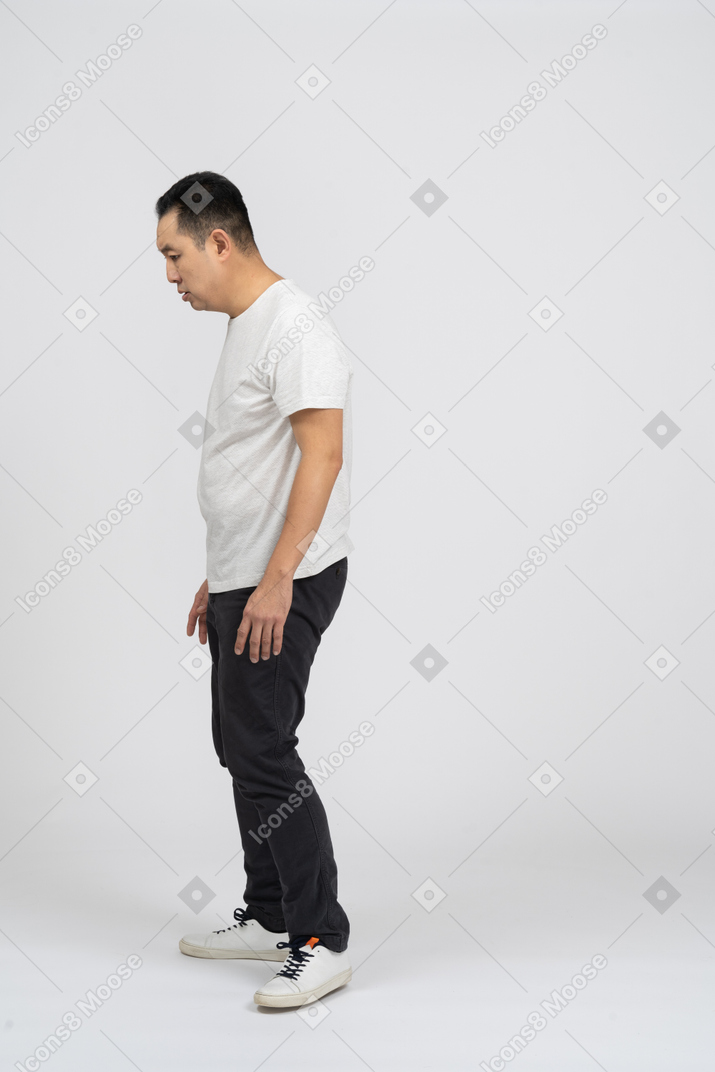Side view of a confused man looking for something