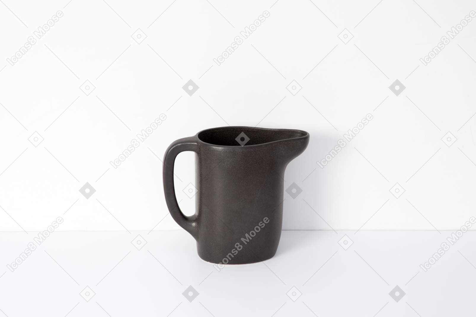Brown ceramic mug with spout