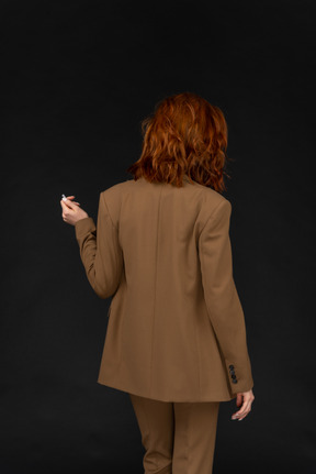 Back view of a woman in a suit