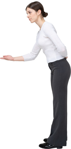 Side view of a woman in suit gesturing