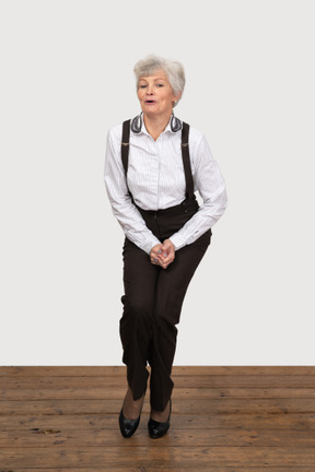 Awkward businesswoman standing with legs pressed together