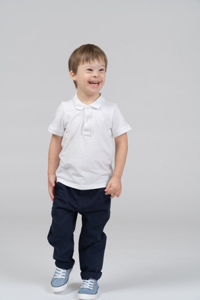 Cheerful boy walking toward the camera