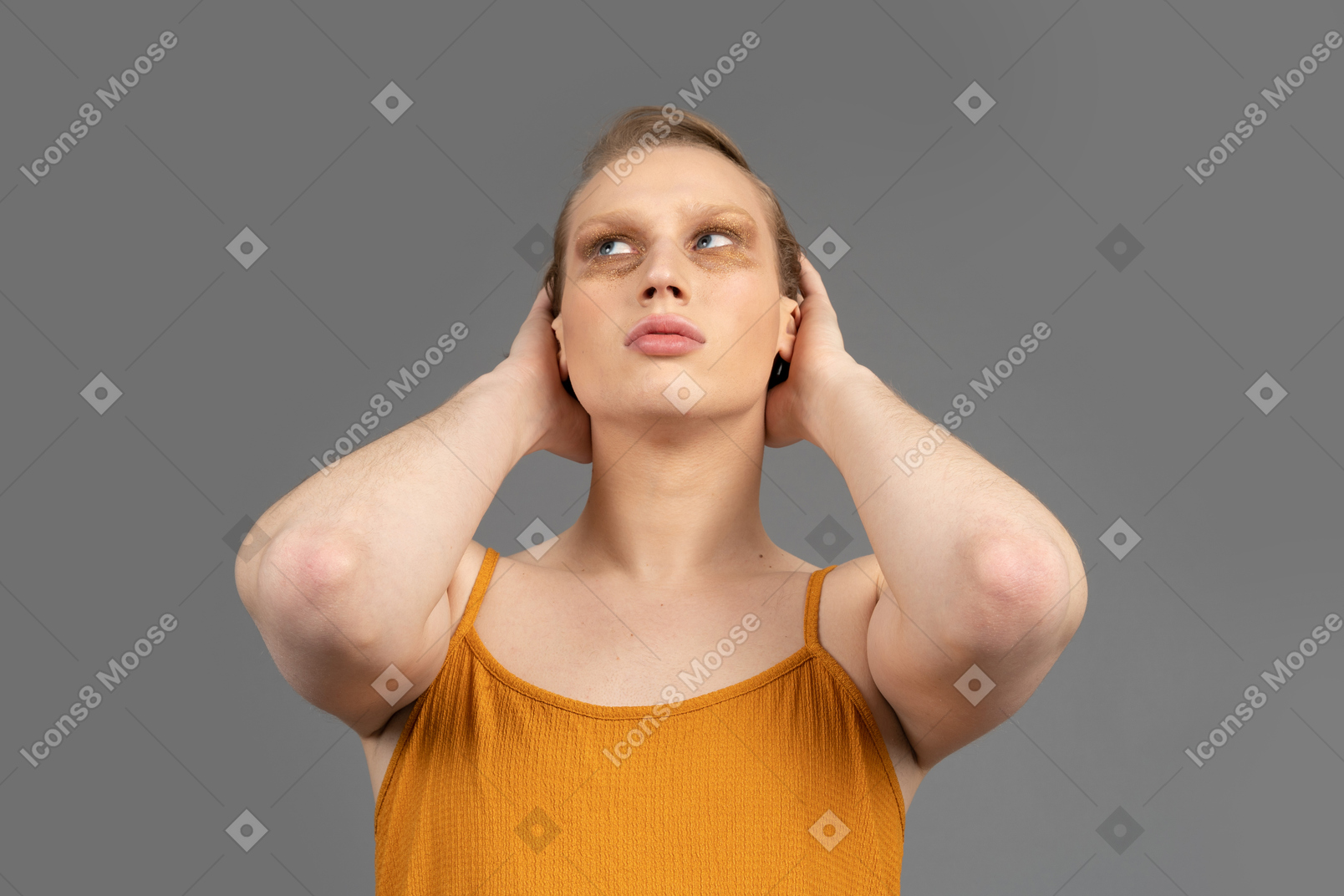 Close-up of a transgender person holding back of their head
